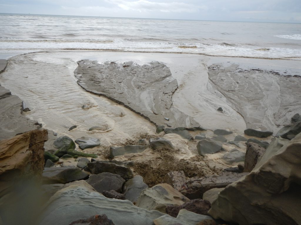 Coastal watershed discharging sediment rich runoff into the Pacific Ocean near Mondos Beach during a 2014 winter storm event.